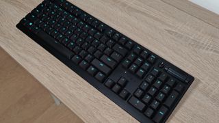 Razer Deathstalker V2 Pro review: black keyboard with blue lights on a table