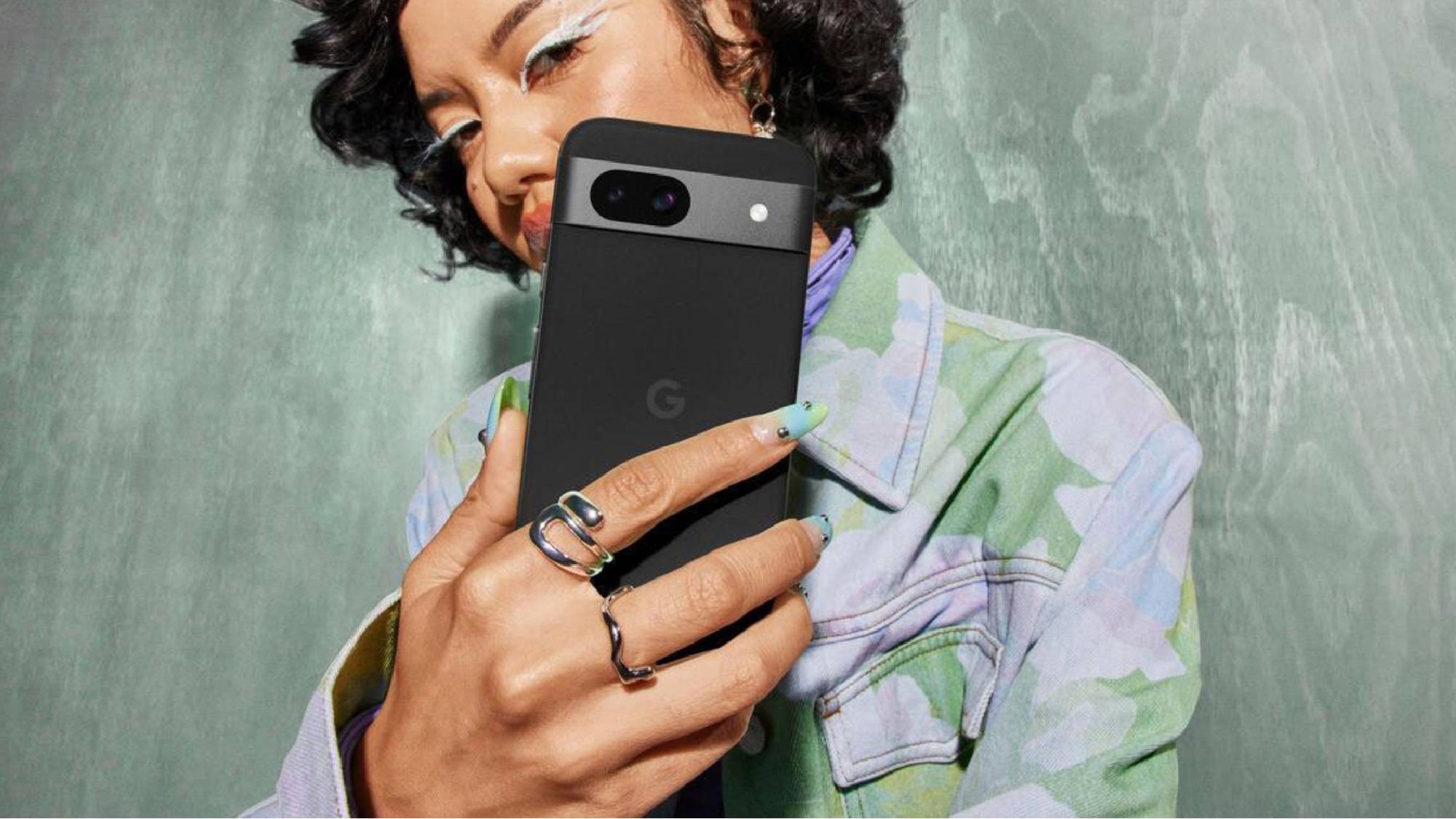 Woman holding Pixel 8a
