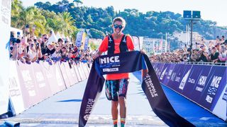 Courtney Dauwalter crossing the finish line at the UTMB Nice