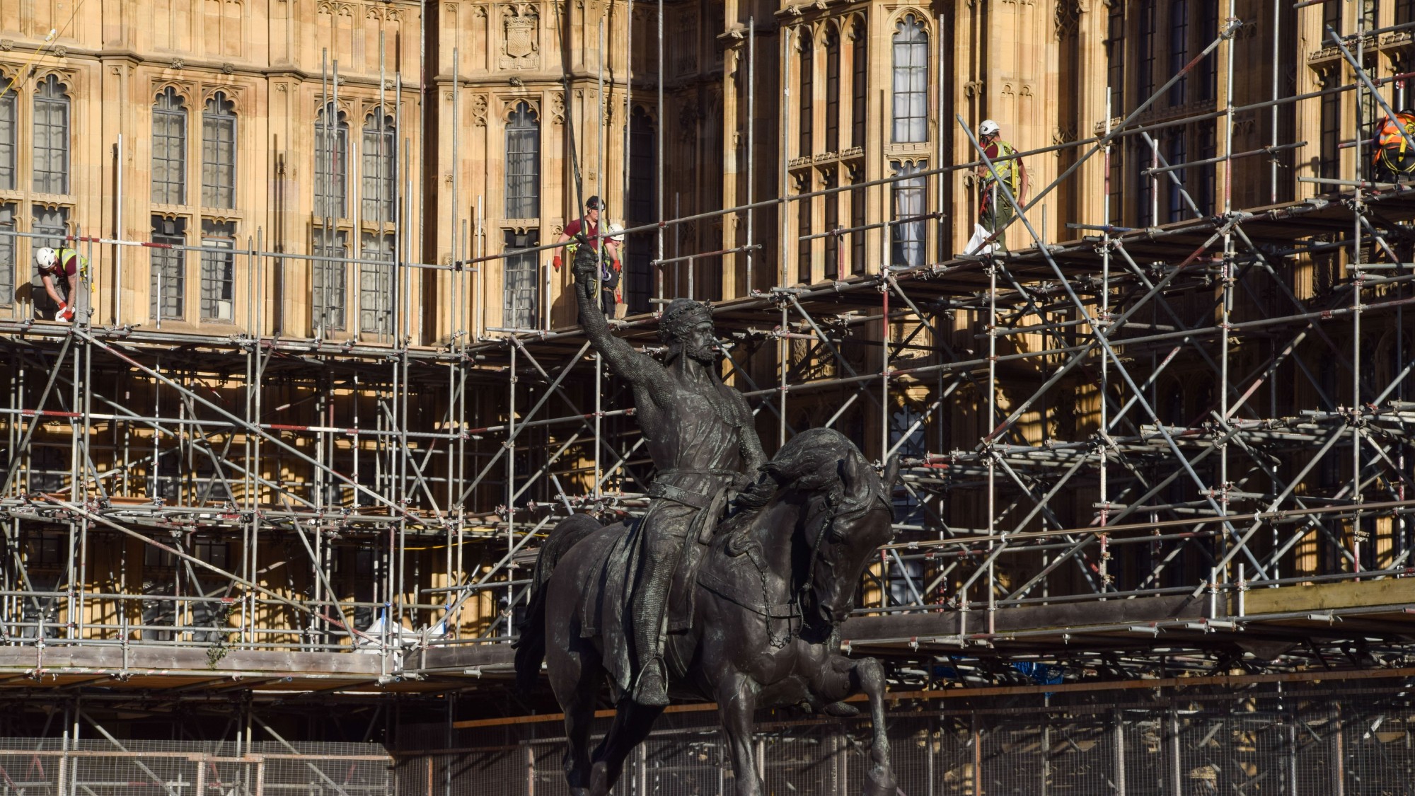 Workers remove scaffolding from parts of the Palace of Westminster