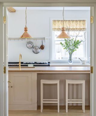 Neutral kitchen with cream painted cabinets