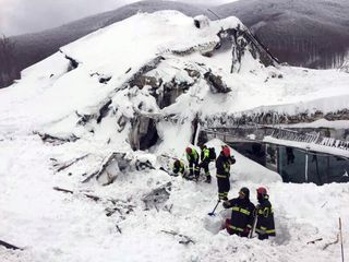 Italian firefighters search for survivors after an avalanche buried a hotel near Farindola, Italy, Thursday, Jan. 19, 2017. 