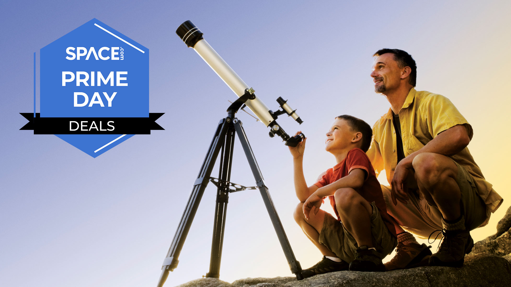 Man and boy using a telescope with a Space.com Prime Day badge.