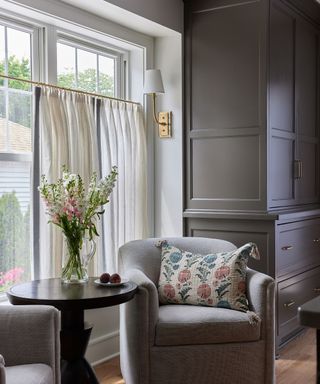 kitchen with seating nook, dark gray cabinets