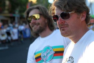 Floys Landis and business partner Dave Zabriske watch the Cascade Cycling Classic criterium in Oregon.