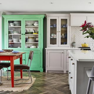 grey kitchen with bright green freestanding vintage dresser