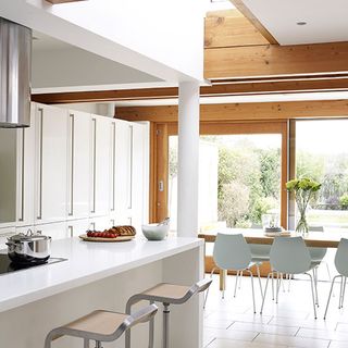kitchen with white cabinet and table and chairs