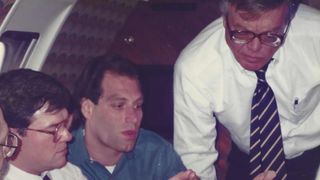 Thomas Cookerly (at right) is shown in consultation with Allbritton General Counsel Jerald Fritz (middle) and Allbritton President Larry Hebert. According to Fritz the photo was taken on the Allbritton corporate plane in April 1989 and the discussion was of funding for the Byron Allen weekend talk show the company produced.