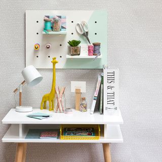 white designed wall white desk with peg board