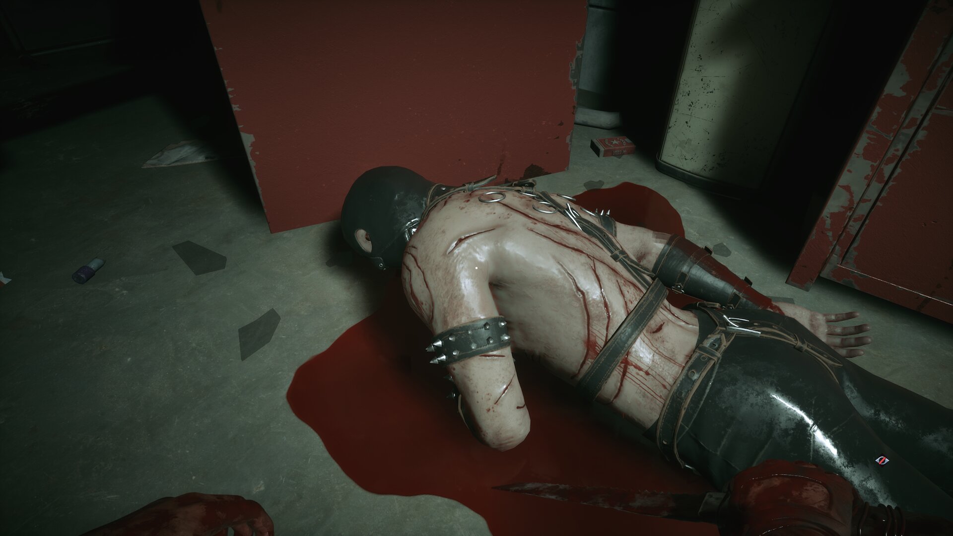 Hellraiser Revival screenshot of a dead cultist in studded leather gear