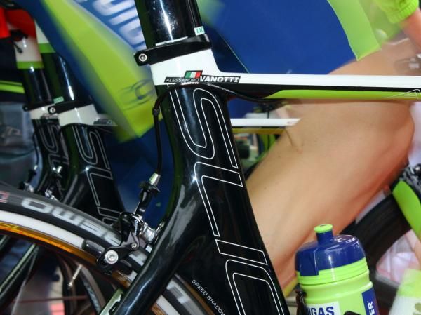 The rear brake housing is fed over and around the seat tube, presumably to tuck it in tighter against the frame.