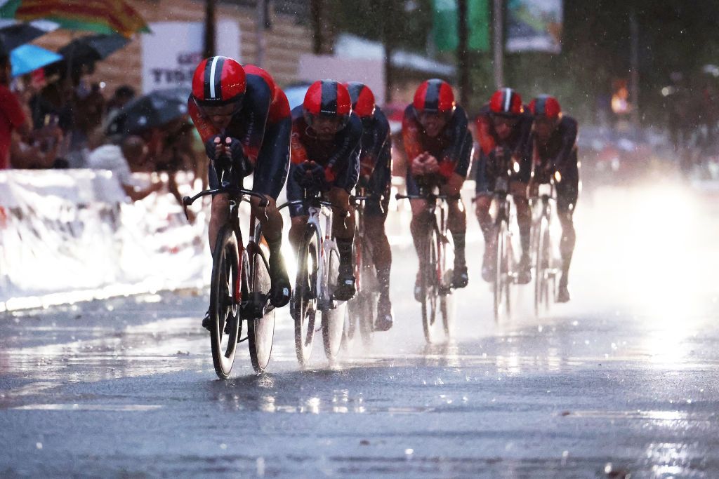 Ineos Grenadiers racing in the miserable conditions