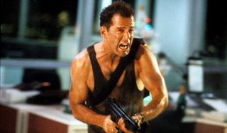 Die Hard Bruce Willis running through the office with a machine gun