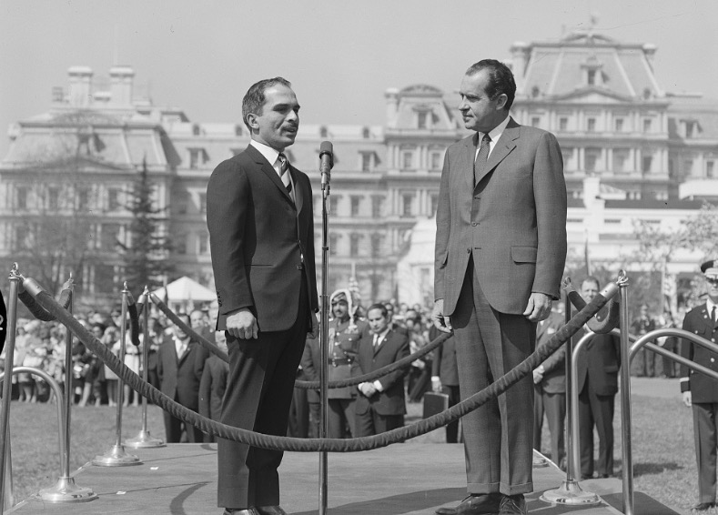 President Richard Nixon and King Hussein of Jordan stand in front of the Old Executive Office Building in 1969.