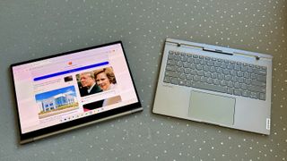The Lenovo ThinkBook Plus Gen 5 Hybrid, with the tablet and keyboard sitting side by side on a couch.