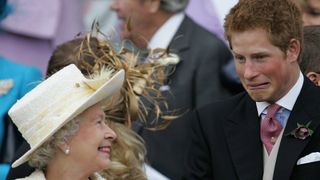 Prince Harry pulling a face to Queen Elizabeth II