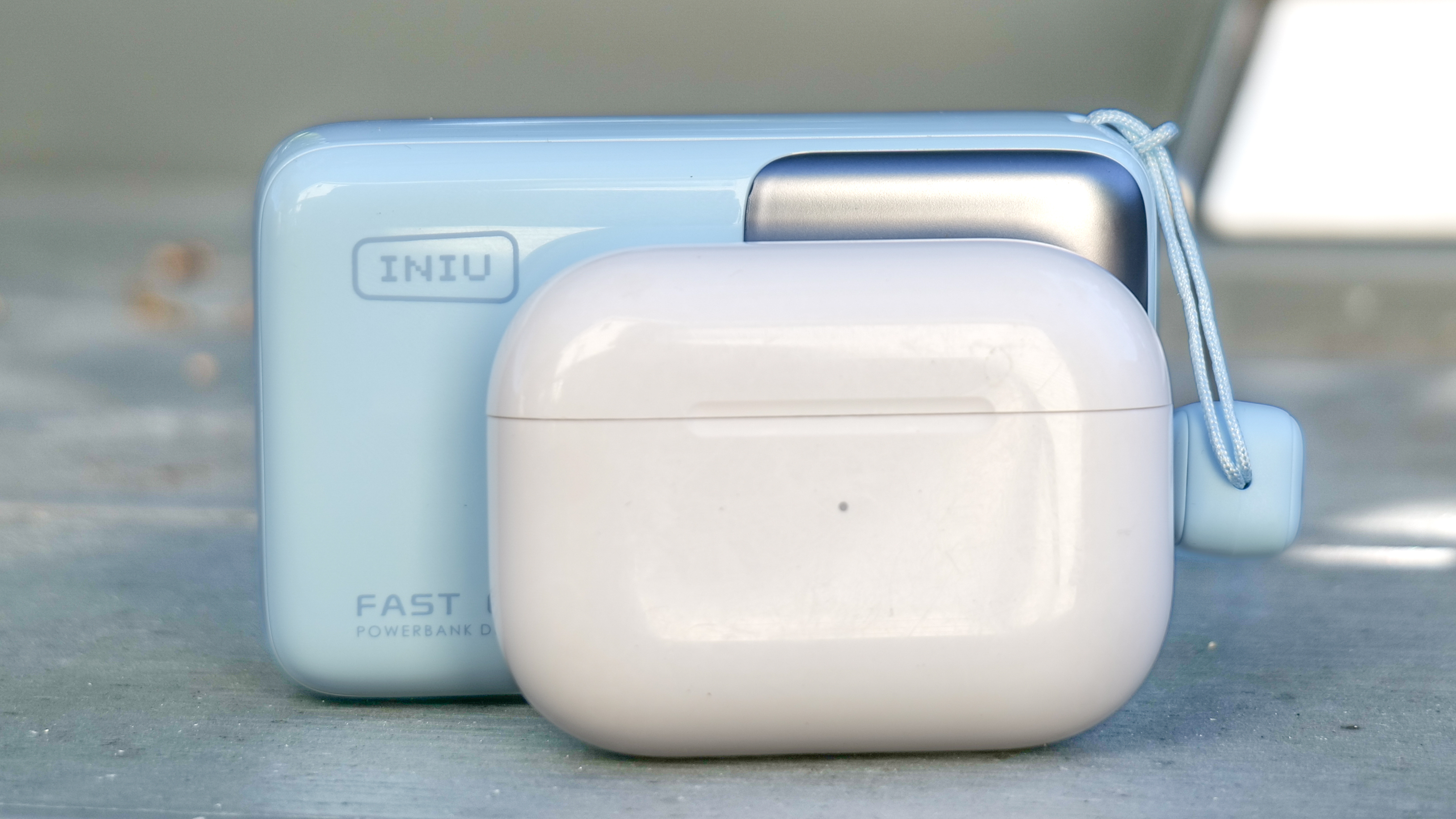 Iniu Pocket Rocket P50 size comparison against AirPods Pro 3 charging case..