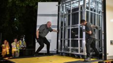 Workers unload a specially designed crate carrying the Bayeux Tapestry at the British Museum in London.