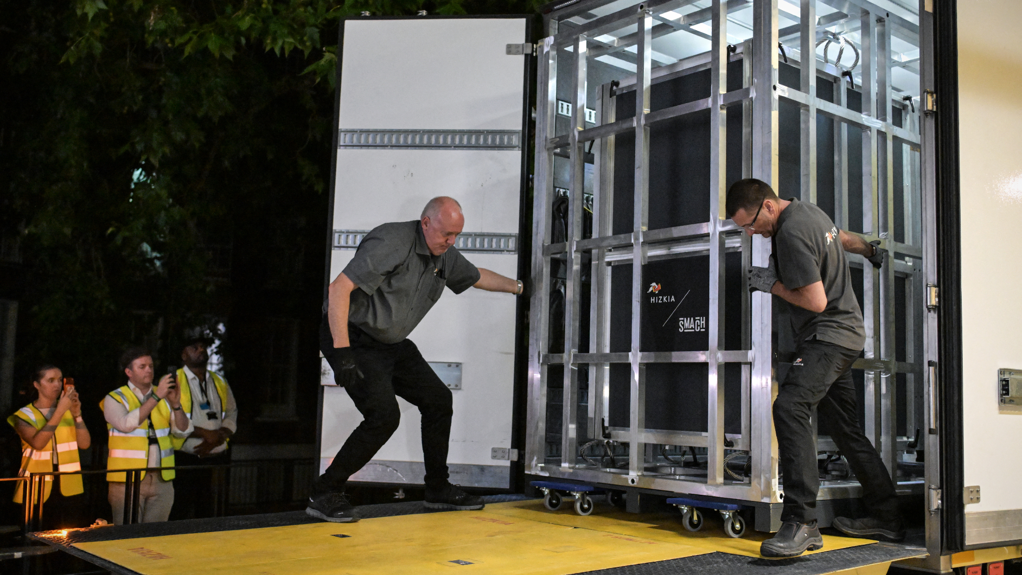 Workers unload a specially designed crate carrying the Bayeux Tapestry at the British Museum in London.