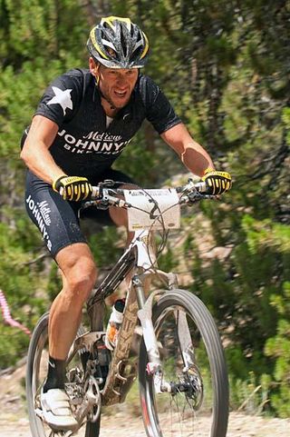 Three Miles from the finish, the stress of a slowly leaking rear tire was showing on on Lance Armstrong's face.