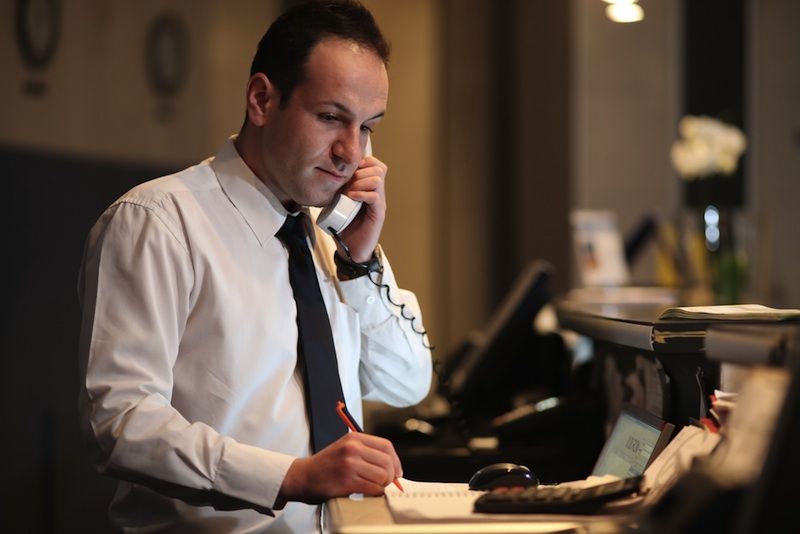 A hotel concierge at desk