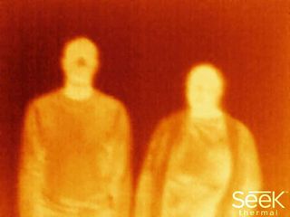 The full thermal images reveals a second person hidden from a normal camera