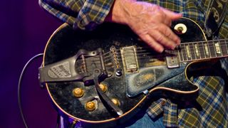  Neil Young (guitar detail) performs at Farm Aid 25: Growing Hope for America at Miller Park on October 2, 2010 in Milwaukee, Wisconsin.