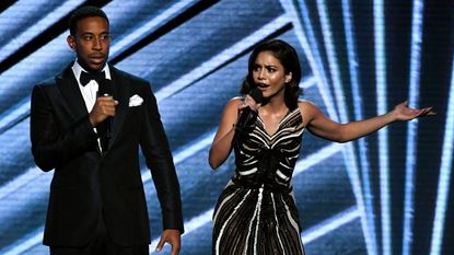 Ludacris and Vanessa Hudgens on stage together.