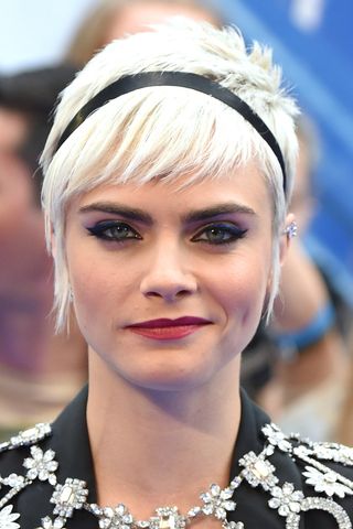 Cara Delevingne has a bleach blonde pixie cut at the "Valerian And The City Of A Thousand Planets" European Premiere at Cineworld Leicester Square on July 24, 2017 in London, England.