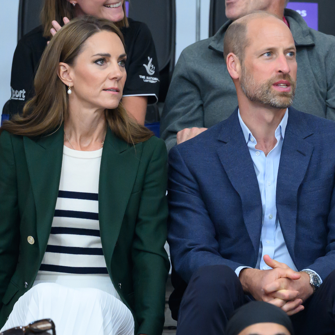 Princess Kate wears a green blazer a Breton striped top and Prince William has a bald head and wears a navy suit