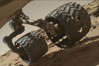 Damage to a wheel on NASA's Curiosity rover on Mars is visible in this image.