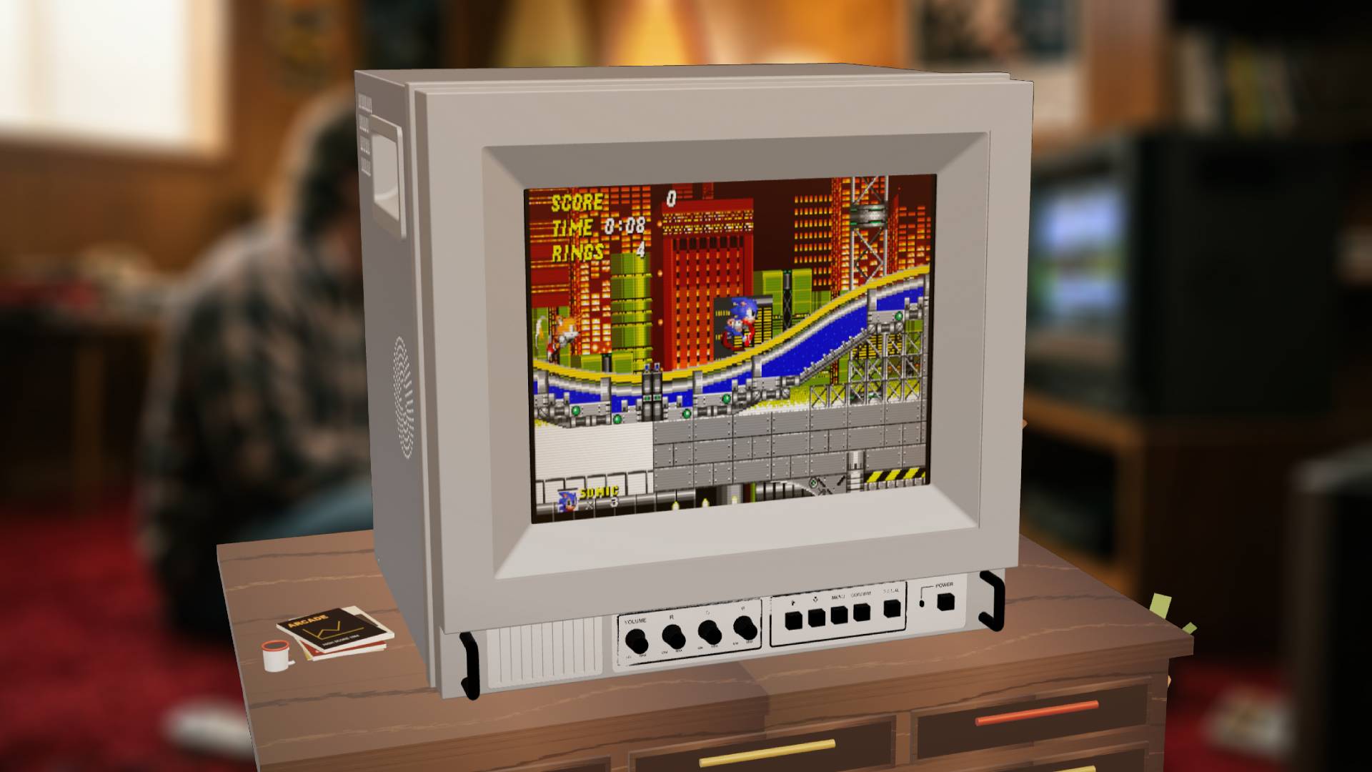 TRAVELLER ULW10 faux CRT TV 3D render and Sonic the Hedgehog 2 gameplay demo with blurred lifestyle imagary in backdrop.