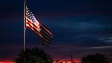 US flag lit up at night