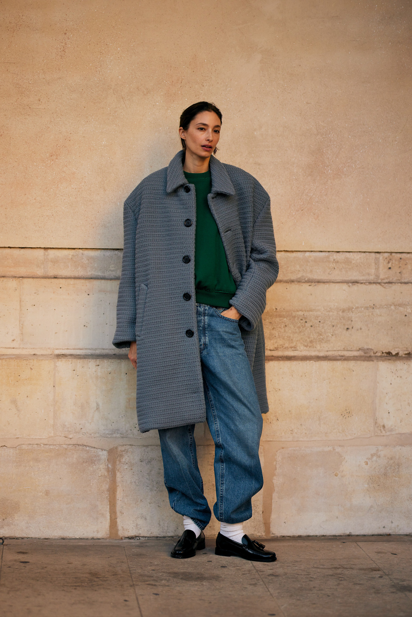 BERLIN, GERMANY - NOVEMBER 07: Sophia Geiss with brown hair seen wearing black Jil Sander shoes, light blue Acne Studios wide jeans, and a beige oversized fur jacket from The Frankie Shop, styled with a brown Zadig & Voltaire bag and brown Mango sunglasses on November 07, 2025 in Berlin, Germany. (Photo by Jeremy Moeller/Getty Images)