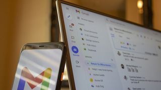 Google Spaces on a laptop and smartphone