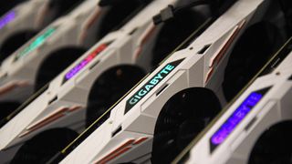 Mulitple graphics card devices manufactured by Gigabyte Technology Co. Ltd. sit on a Graphic Processing Unit (GPU) mining rig manufactured by Easy Crypto Hunter, during the Crypto Investor Show in London, U.K., on Saturday, March 10, 2018.