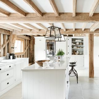 kitchen with wooden beams and lighting