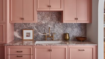 A pink Shaker style kitchen