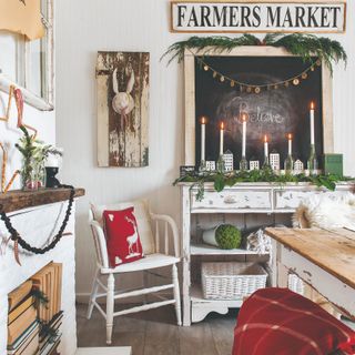 A rustic dining room in a cottagecore style decorated for Christmas