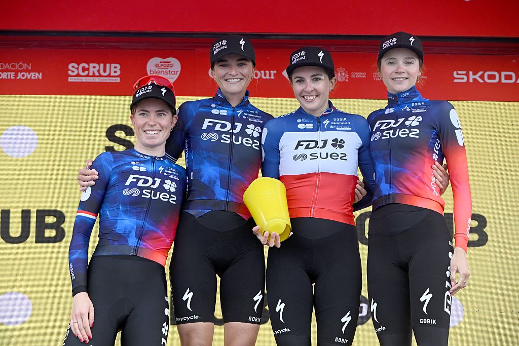 (From L) FDJ-Suez team's Dutch rider Demi Vollering, Dutch rider Ally Maree Wollaston, French rider Juliette Labous and French rider Evita Muzic pose with the Best Team trophy on the podium of the 7th stage of the 2025 La Vuelta Femenina cycling tour of Spain, a 152.6 km race from La Robla to Cotobello, on May 10, 2025. (Photo by MIGUEL RIOPA / AFP)