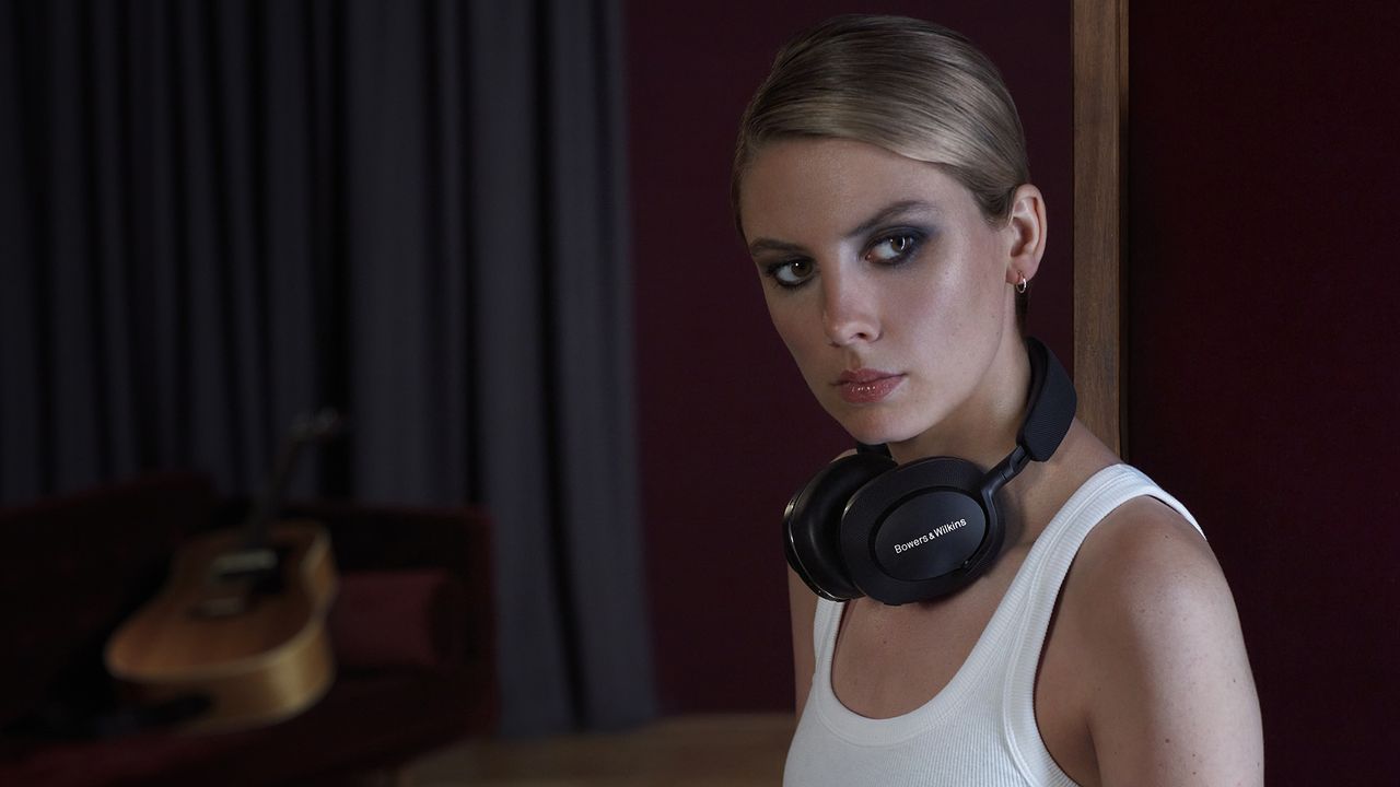 A woman wearing the Bowers &amp; Wilkins Px8 headphones