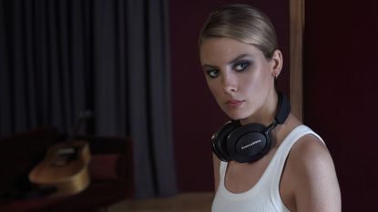 A woman wearing the Bowers & Wilkins Px8 headphones