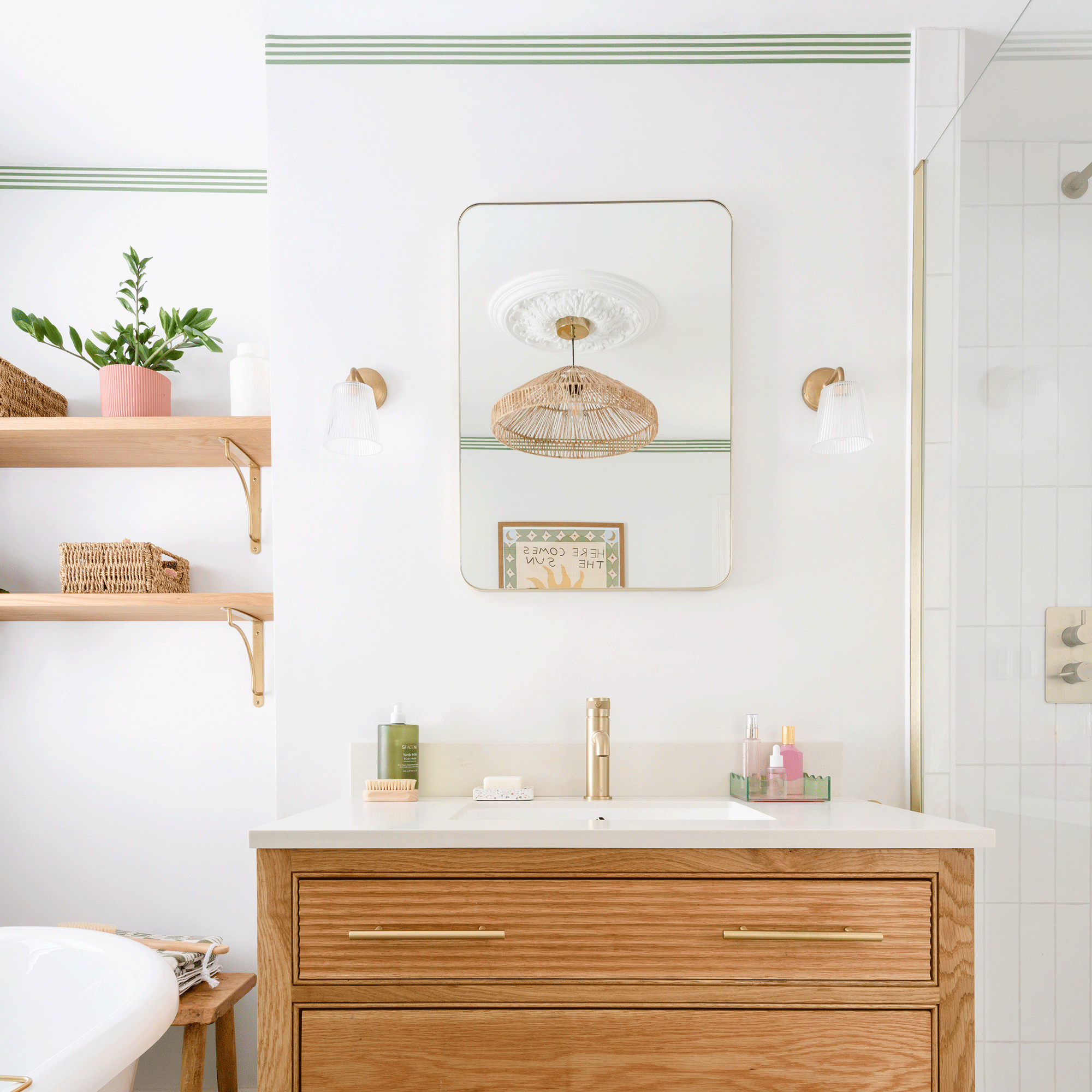 a small white bathroom with a wooden vanity sink unit with matching wooden shelving