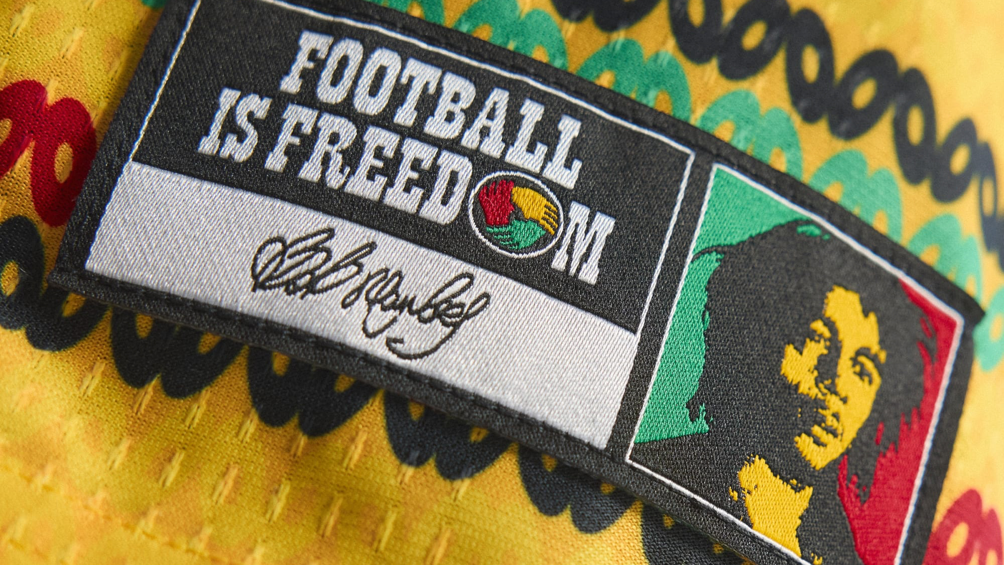 Close up details of the Jamaica 26 home jersey featuring Bob Marley