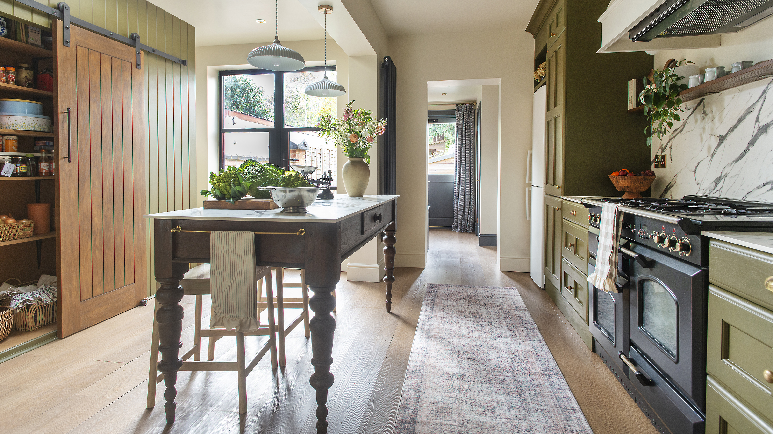 Kitchen island prep table in kitchen
