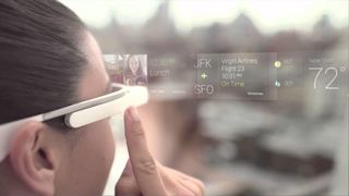 Google Glass smart glasses being worn by woman, a visual representation of the heads-up display is shown in front of her