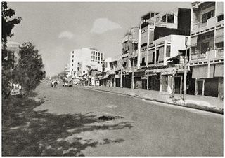 Black and white photograph of quiet street