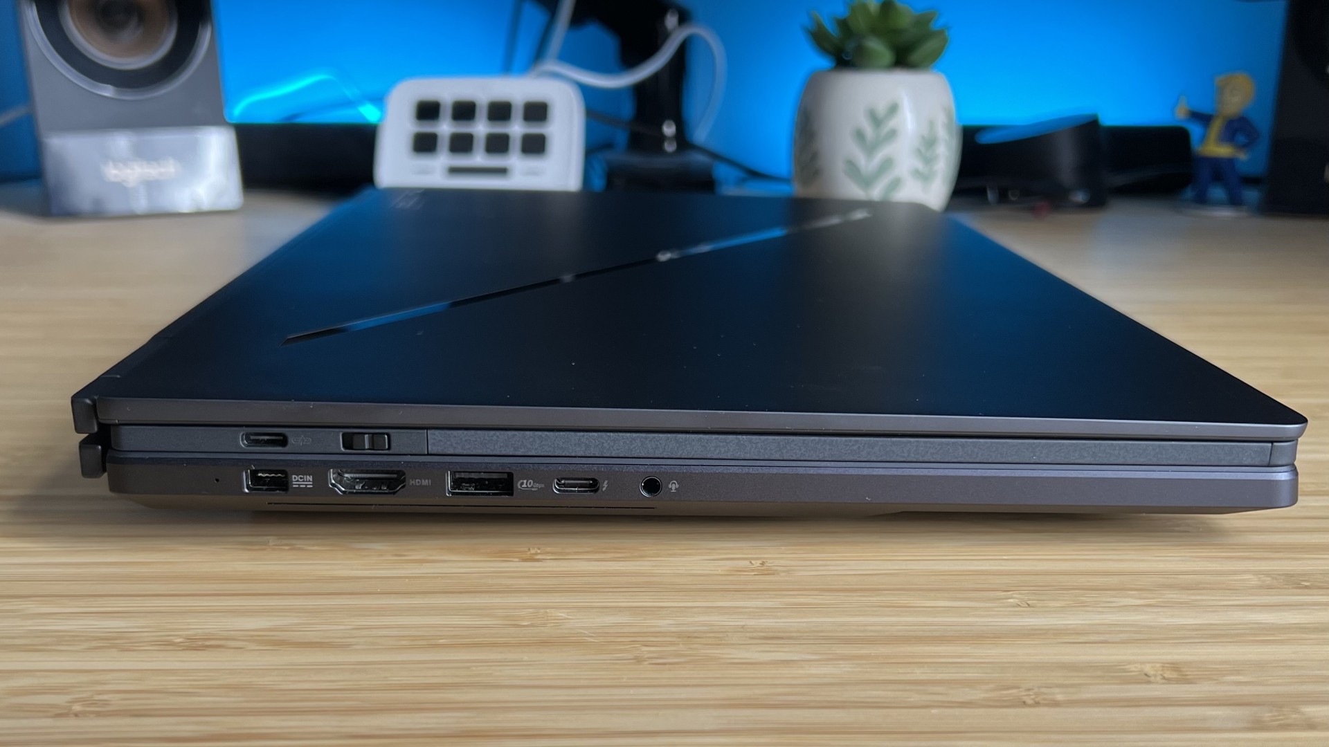 Closed Asus ROG Zephyrus Duo gaming laptop on a wooden desk