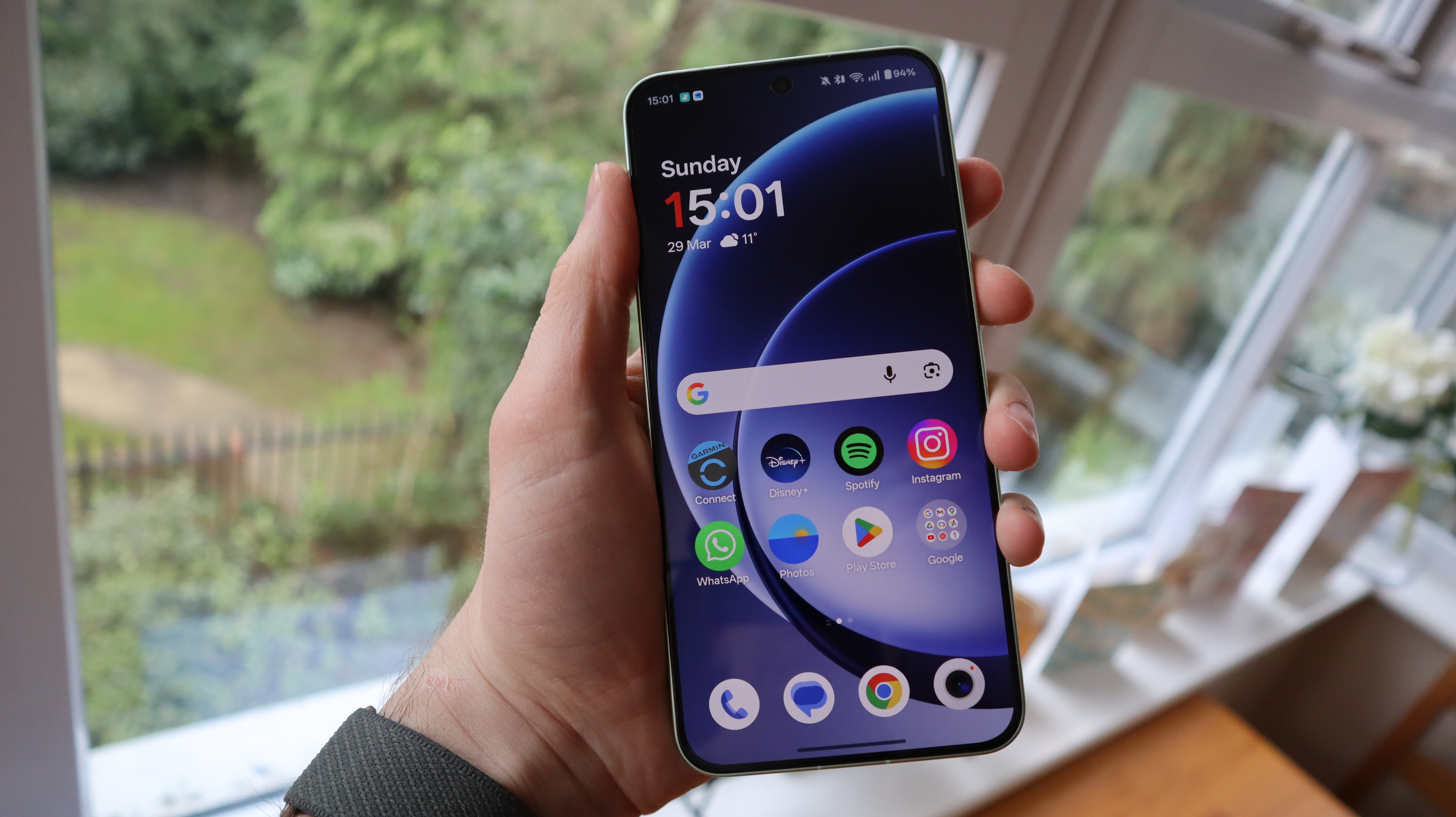 OnePlus 15R being held in the hand