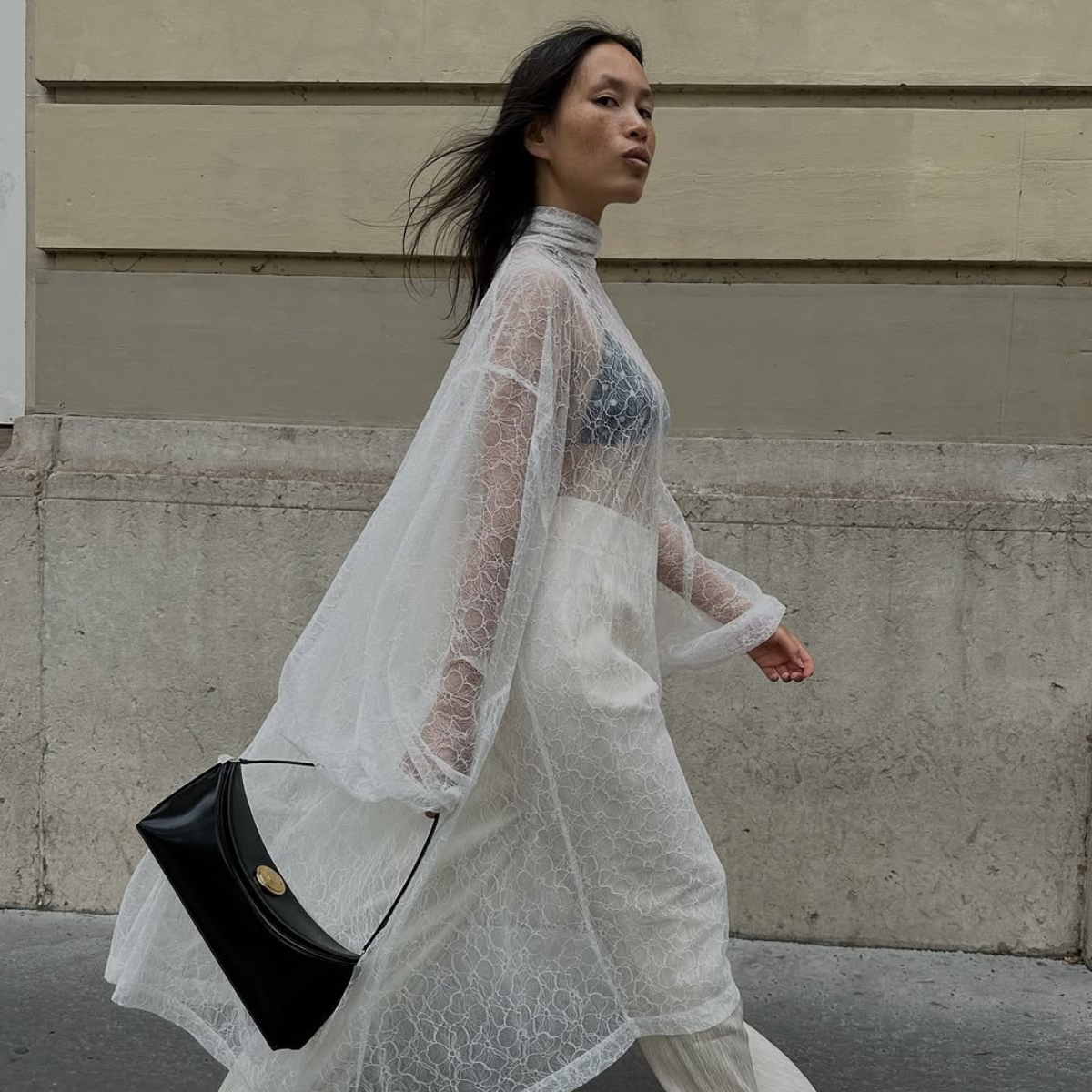 woman wearing dress over pants fall outfit 2025